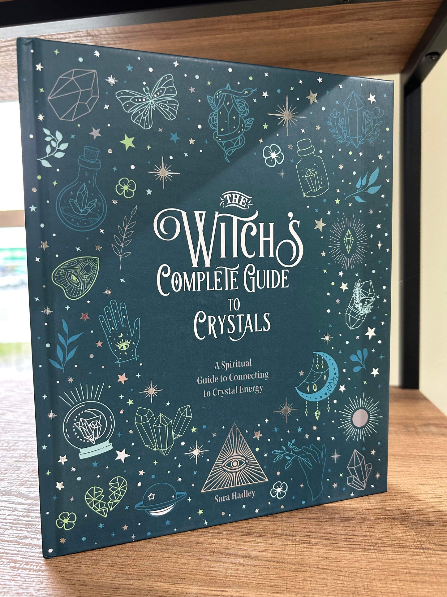 The Witch's Complete Guide to Crystals by Sara Hadley
